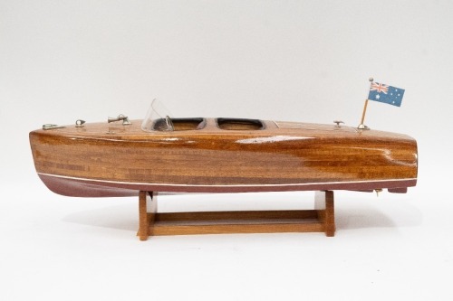 RIVA BOAT: A fine model Riva style boat on timber base, 18cm high, 62cm long