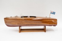 RIVA BOAT: A fine model Riva style boat on timber base, 18cm high, 62cm long