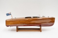RIVA BOAT: A fine model Riva style boat on timber base, 18cm high, 62cm long - 2