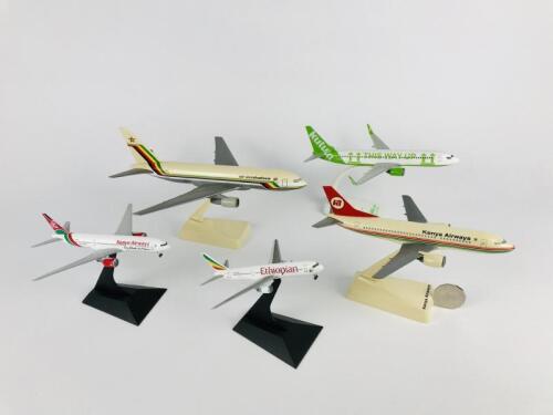 MULTIPLE AFRICAN AIRLINES: Five models (longest 24cm): A 1:200 scale Air Zimbabwe Boeing 767 plastic model, A 1:200 scale Kenya Airways Boeing 737 plastic model, A 1:200 scale Kulula Airways Boeing 737 plastic model, reigistration 'ZS-ZWO', A 1:400 scale 