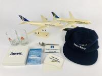 ANSETT: 9 items 1990's: A 1:200 scale (30cm long) Ansett Boeing 747 plastic model on stand, A 1:200 scale Ansett Boeing 777 plastic model on stand, one Ansett Australia wool, viscose cap, one Ansett teaspoon, one Ansett unused deck of playing cards, a se - 3