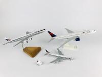 DELTA: 4 models (longest 33cm): A 1:200 scale Boeing 777-200LR resin model on stand, A 1:400 scale Boeing 747-400 metal model on wheels, registration 'N9896', A 1:200 scale McDonnell Douglas DC8 wooden model on stand and one Delta plastic toy plane on pul - 2