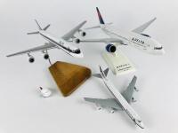 DELTA: 4 models (longest 33cm): A 1:200 scale Boeing 777-200LR resin model on stand, A 1:400 scale Boeing 747-400 metal model on wheels, registration 'N9896', A 1:200 scale McDonnell Douglas DC8 wooden model on stand and one Delta plastic toy plane on pul - 4