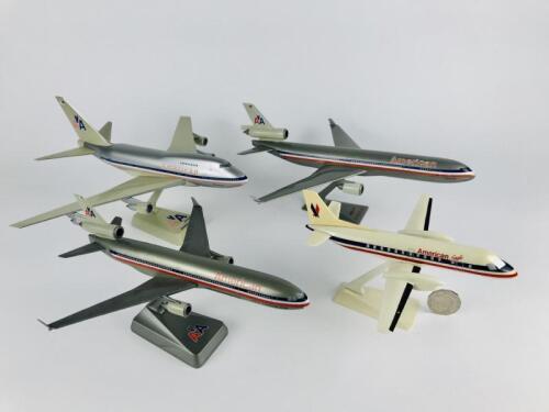 AMERICAN AIRLINES: 4 models (longest 32cm): A 1:150 scale MD11 'Luxury liner' plastic model, registration 'N1750B', A 1:200 MD11 'Luxury Liner' plastic model, A 1:200 scale Boeing 747 'Luxury Liner' plastic model, registration 'N602AA', and A 1:100 scale
