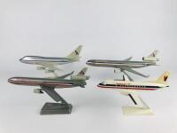 AMERICAN AIRLINES: 4 models (longest 32cm): A 1:150 scale MD11 'Luxury liner' plastic model, registration 'N1750B', A 1:200 MD11 'Luxury Liner' plastic model, A 1:200 scale Boeing 747 'Luxury Liner' plastic model, registration 'N602AA', and A 1:100 scale - 3