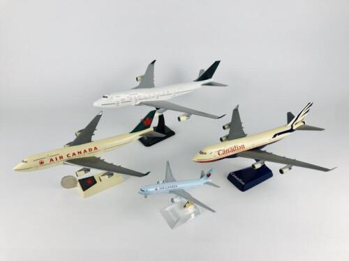 AIR CANADA: 4 Models (longest 36cm): A 1:150 scale Boeing 747-400 resin model. A 1:200 scale Boeing 747-400 plastic model. A 1:200 scale 'Canadian' plastic model and A 1:400 scale Boeing 777 metal model with wheels on stand.
