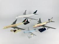 AIR CANADA: 4 Models (longest 36cm): A 1:150 scale Boeing 747-400 resin model. A 1:200 scale Boeing 747-400 plastic model. A 1:200 scale 'Canadian' plastic model and A 1:400 scale Boeing 777 metal model with wheels on stand.