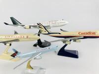 AIR CANADA: 4 Models (longest 36cm): A 1:150 scale Boeing 747-400 resin model. A 1:200 scale Boeing 747-400 plastic model. A 1:200 scale 'Canadian' plastic model and A 1:400 scale Boeing 777 metal model with wheels on stand. - 4