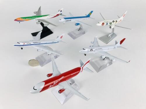 1:400 SCALE METAL MODELS: 6 models (all 16cm long): A 1:400 scale Air Asia A-320 metal model with wheels on stand, A 1:400 scale Uzbekistan Boeing 757-200 metal model with wheels on stand, A 1:400 scale China Eastern metal model, registration 'B6055', A 1