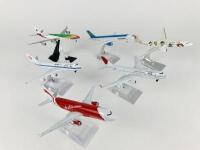 1:400 SCALE METAL MODELS: 6 models (all 16cm long): A 1:400 scale Air Asia A-320 metal model with wheels on stand, A 1:400 scale Uzbekistan Boeing 757-200 metal model with wheels on stand, A 1:400 scale China Eastern metal model, registration 'B6055', A 1 - 2