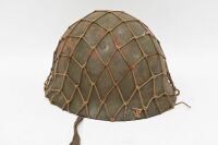 HELMET: A vintage military helmet, with interior leather strapping and exterior webbing