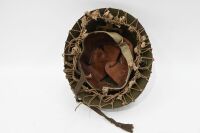 HELMET: A vintage military helmet, with interior leather strapping and exterior webbing - 3