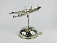 BOAC ART DECO DESK PIECE: A chrome plated articulating plane with spinnable propellors on a chrome half globe.
