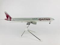 QATAR BOEING 777: A 1:100 scale (37cm long) resin model, with wheels on stand, registration 'A7-BAA'. - 2