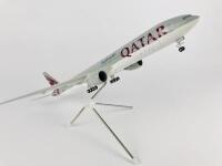 QATAR BOEING 777: A 1:100 scale (37cm long) resin model, with wheels on stand, registration 'A7-BAA'. - 3