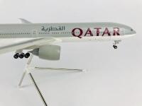 QATAR BOEING 777: A 1:100 scale (37cm long) resin model, with wheels on stand, registration 'A7-BAA'. - 4