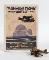 SCHNEIDER TROPHY: A reproduced programme of the 1931 Schneider Trophy Contest together with a small cast iron U.S Navy bi-plane model, 10cm long