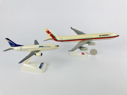PORTUGUESE CARRIERS: Two models (longest 32cm): A 1:200 scale Air Portugal Airbus A340 'Ferri Mendes Pinto' plastic model, registration 'CS-TOA' and A 1:200 scale SATA International Azores plastic model 'Sao Jorge', registration, 'CS-TGQ'