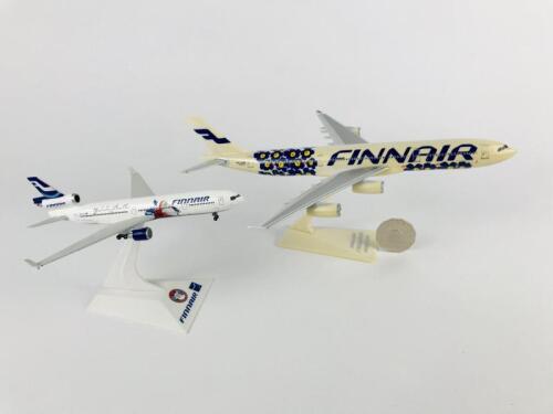 FINNAIR: Two models (longest 26cm): A 1:200 scale Airbus A340 plastic model, registration 'OH-LQD', and A 1:400 scale McDonnell Douglas MD11 metal model, with wheels on stand, registration ' OH-LGA'