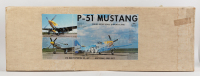 P-51 MUSTANG: A SIG Kwik Bilt (USA), 1:6 scale P-51 Mustang radio controlled model kit, model No.KBRC-6, appears complete, length when complete 1.22m, wingspan 1.63m