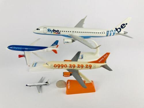 BRITISH CARRIERS: Four models (longest 36cm): A 1:100 scale FlyBe Embraer 195 plastic model, registration 'G-FBEB': A 1:200 scale British Midland Airbus A-320 plastic model, A 1:200 scale EasyJet Boeing 727 plastic model, and A 1:800 scale British Caledon
