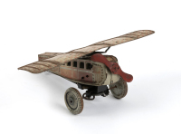 TINPLATE MODEL: A circa 1920s or 1930s German made clockwork tinplate aeroplane model, believed to be SG brand, 23cm long, wingspan 26cm