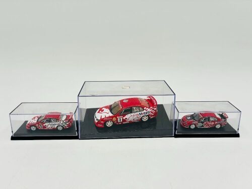 111 · HRT: Three HRT VX Commodore models including a 1:43 scale model by Autoart and two 1:64 scale models by Biante, all with display cases [Location: Sydney]