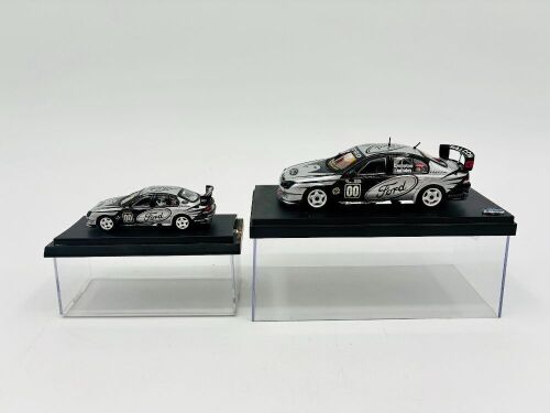 113 · GIBSON MOTORSPORT: Two Biante models of the Gibson Motorsport 'Green Eyed Monster' Ford AU Falcon driven by Craig Lowndes including a 1:43 and a 1:64 scale models, both with display cases [Location: Sydney]