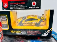 RC CARS: Four RC V8 Supercars in various scales including a BA Falcon, VE Commodore, Nissan Altima and Mustang, all in original packaging [Location: Sydney] - 2