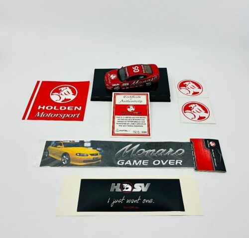 HOLDEN MONARO: A 1:43 scale Autoart model of the Holden Monaro CV8 driven by Peter Brock in the 2002 Targa Tasmania, limited edition 0455/5000, complete with original packaging and certificate of authenticity, together with a group of Holden stickers [Location: Sydney]