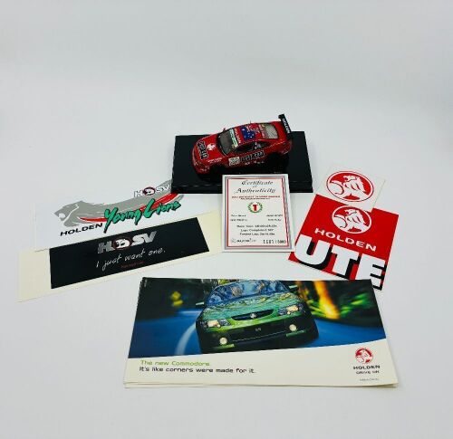 118 · HOLDEN MONARO: A 1:43 scale Autoart model of the #05 Holden Monaro 427, winner of the 2003 Bathurst 24 Hour, limited edition 1601/3000, complete with original packaging and certificate of authenticity, together with a group of Holden stickers [Location: Sydney]