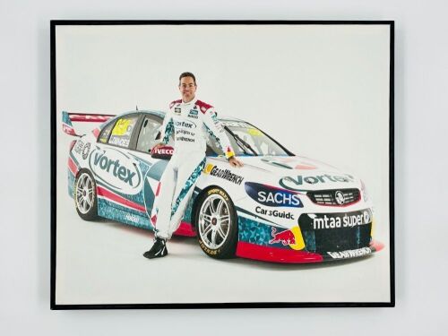CRAIG LOWNDES: A framed photo featuring Craig Lowndes and his #888 Team Vortex VF Commodore from the 2017 Supercars season, 51.5cm high, 61.5cm wide [Location: Sydney]