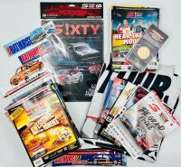 BATHURST: A large group of Bathurst memorabilia including a flag from the 2024 race, a commemorative coin celebrating 50 years of the Bathurst 1000. a 60th anniversary tin sign and a group of race programmes and stickers [Location: Sydney]