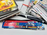 BATHURST: A large group of Bathurst memorabilia including a flag from the 2024 race, a commemorative coin celebrating 50 years of the Bathurst 1000. a 60th anniversary tin sign and a group of race programmes and stickers [Location: Sydney] - 7