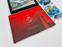 MAD MIKE WHIDDETT: A hardcover book, 'One Perfect Lap: The Wild History of the World Time Attack Challenge, together with 3 Hot Wheels models including one signed by Mad Mike and a framed photo of Mad Mike's Mazda 3 [Location: Sydney] - 2