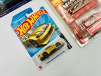 NISSAN: Three Hot Wheels 1:64 scale Nissan models together with a Muscle Machines 1:64 scale model and a group of Nismo flyers [Location: Sydney] - 3