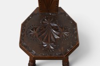 SPINNING CHAIR: An antique timber, carved spinning chair, measures 101cm high. Thought to be oak. - 4