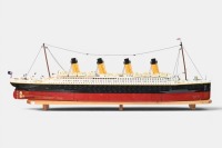 RMS TITANIC: A large lego model of the RMS Titanic, completed, 133cm long, resting on timber base