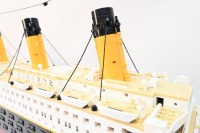 RMS TITANIC: A large lego model of the RMS Titanic, completed, 133cm long, resting on timber base - 4