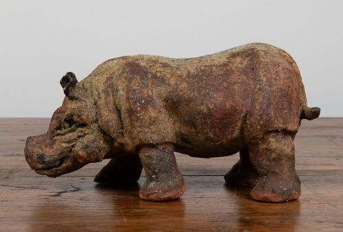 102 · TERRACOTTA SCULPTURE: A Terracotta sculpture of a Hippopotamus, 13cm high, 28cm wide