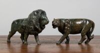 STONE LION / LIONESS: Two carved stone figures of a lion & Lioness, Lion measures 22cm high, 35cm wide