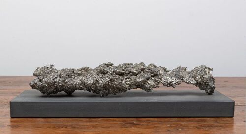 41 · TIN SLAG: A decorative tin stag section on displayed on stone pedestal base, not affixed, base length 50cm, sculpture 43cm, weight 4.05kg (UPDATED DESCRIPTION)
