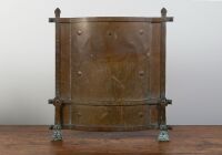 ARTS & CRAFTS: A c1910 brass arts & crafts style fireplace shield, 68cm high, 68cm wide
