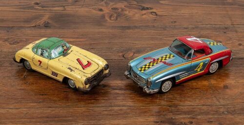 92 · TIN TOYS: Two circa 1950s Japanese Mercedes 300SL friction tin toys in racing livery, largest 21cm long