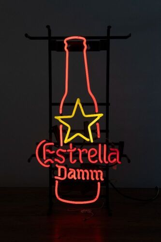ESTRELLA DAMM: An illuminated Estrella Damm cerveza (beer) sign fixed to floor standing frame, 65cm high, 36cm wide
