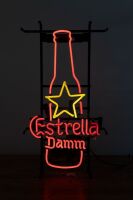 ESTRELLA DAMM: An illuminated Estrella Damm cerveza (beer) sign fixed to floor standing frame, 65cm high, 36cm wide