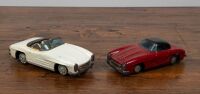 MERCEDES: Two circa 1950s Japanese Mercedes-Benz 300SL friction tin toys, largest 20cm long