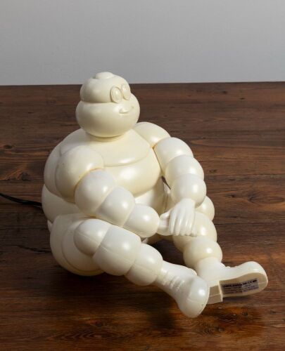 MICHELIN: A fun circa 1990s plastic Bibendum form lamp, lacking plug end, 23cm high