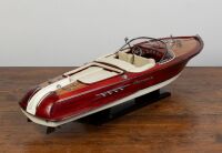 RIVA AQUARAMA: A large Riva Aquarama model speedboat on ebonised timber base, 43cm high (on base), approx. 160cm long - 2