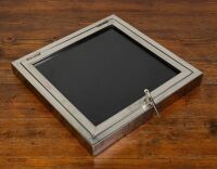 A decorative small circa 1940s/1950s nickel plated brass wall mount display case with key, as used in mid-century office building reception areas